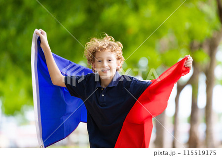 Child with French flag. Kid cheering for France. 115519175