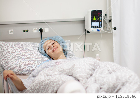 Young woman in hospital recovery room after surgery Young woman in hospital recovery room after surgery 115519366