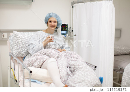 Young woman in hospital recovery room after surgery 115519371