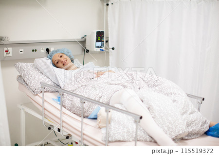 Young woman in hospital recovery room after surgery 115519372