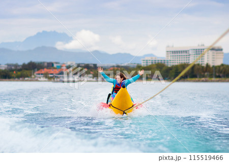 Banana boat ride. Kids on the beach. Banana boat ride. Kids on the beach. 115519466