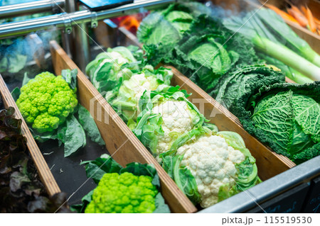 Market counter with assortment of farm fresh organic vegetables Market counter with assortment of farm fresh organic vegetables 115519530
