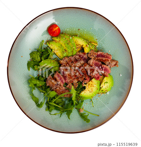 Tasty fried beef with avocado, parsley, sesame and tomatoes 115519639