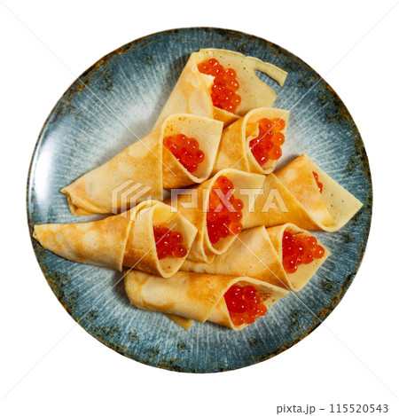 Pancakes with red caviar dished up in service plate. Traditional Russian cuisine 115520543