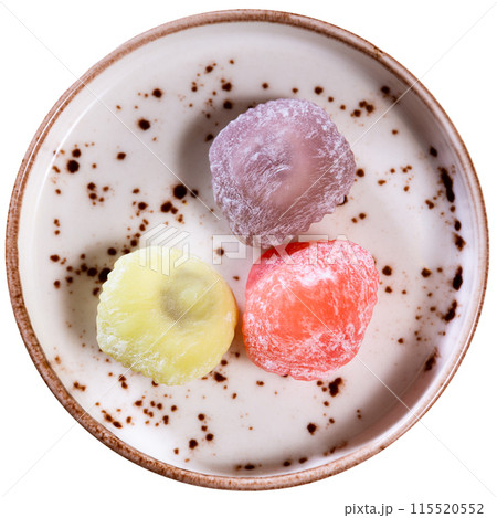 Mochi ice cream and wooden sticks on japanese plate closeup Mochi ice cream and wooden sticks on japanese plate closeup 115520552