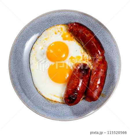 Fried egg with chorizo sausage served for breakfast 115520566