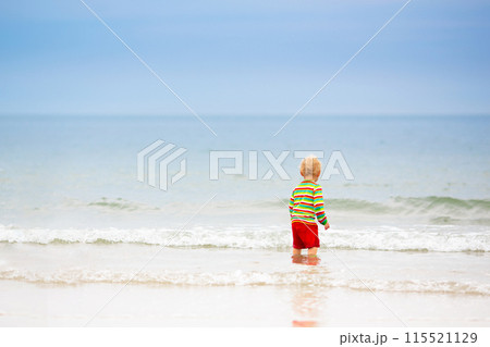 Kids playing on beach. Children play at sea. Kids playing on beach. Children play at sea. 115521129