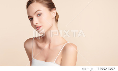 Beautiful young woman with clean fresh skin on beige background, Face care, Facial treatment, Cosmetology, beauty and spa, women portrait. Beautiful young woman with clean fresh skin on beige background, Face care, Facial treatment, Cosmetology, beauty and spa, women portrait. 115521357