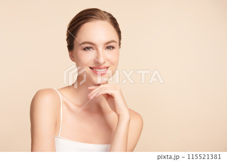 Beautiful young woman with clean fresh skin on beige background, Face care, Facial treatment, Cosmetology, beauty and spa, women portrait. 115521381