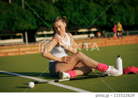 girl hockey player plays field hockey on a sunny day, a hockey player was injured in a game of field hockey 115522629