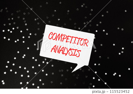 A white sign with red letters that says Competitor Analysis 115523452