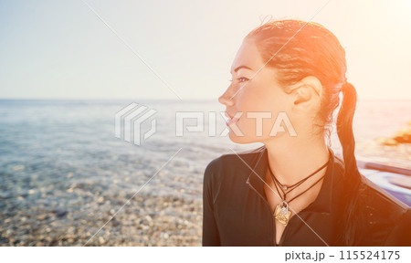 Woman summer travel sea. Happy tourist enjoy taking selfie photo outdoors for memories. Woman traveler posing on the beach at sea surrounded by volcanic mountains, sharing travel adventure journey Woman summer travel sea. Happy tourist enjoy taking selfie photo outdoors for memories. Woman traveler posing on the beach at sea surrounded by volcanic mountains, sharing travel adventure journey 115524175