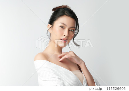 Beautiful young asian woman with clean fresh skin on white background, Face care, Facial treatment, Cosmetology, beauty and spa, Asian women portrait. Beautiful young asian woman with clean fresh skin on white background, Face care, Facial treatment, Cosmetology, beauty and spa, Asian women portrait. 115526603