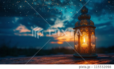 Ornate Lantern Illuminates Starry Night Sky at Sunset 115532098