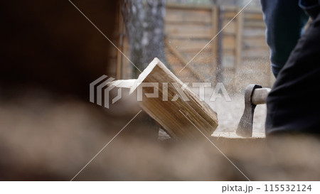 Chopping wood, winter, close-up. Chopping wood in winter. Chopping wood, winter, close-up. Chopping wood in winter. 115532124