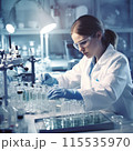 Medical science laboratory: Scientist looking under a microscope, doing analysis on a test sample. Young ambitious biotechnology specialist working with modern equipment 115535970