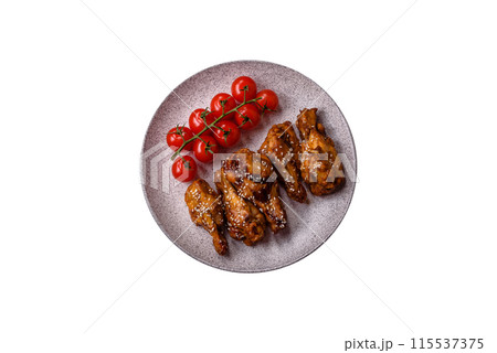 Delicious crispy grilled wings with teriyaki sauce with salt, spices 115537375