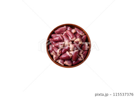 Raw chicken hearts with salt, spices and herbs 115537376