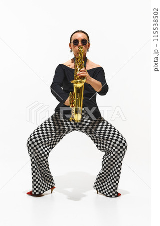 Modern Jazz Fusion. Portrait of stylish lady, musician performing solo with saxophone isolated on white background 115538502