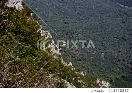 Mount Ai-petri.View from above. The view from the mountain, from below there is a valley flowing into the Black Sea, you can also see the funicular. Mount Ai-petri.View from above. The view from the mountain, from below there is a valley flowing into the Black Sea, you can also see the funicular. 115538837