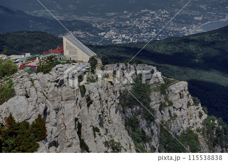 Mount Ai-petri.View from above. The view from the mountain, from below there is a valley flowing into the Black Sea, you can also see the funicular. Mount Ai-petri.View from above. The view from the mountain, from below there is a valley flowing into the Black Sea, you can also see the funicular. 115538838