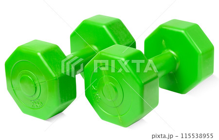 Green plastic dumbbell on a white isolated background, sports equipment Green plastic dumbbell on a white isolated background, sports equipment 115538955