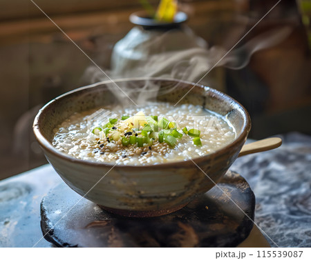 Steam of Mush or boiled rice asian style with smoke in wood bowl on dark background.1 115539087