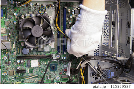 top view mechanic repairing computer top view mechanic repairing computer 115539587