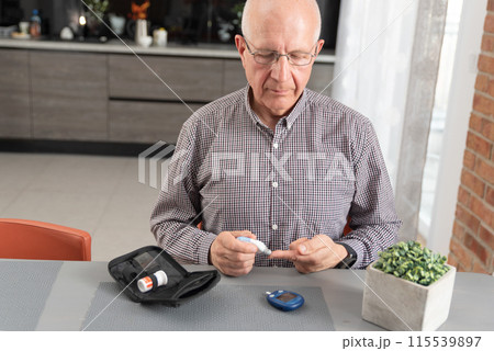 Man measures his blood sugar. Diabetes concept 115539897