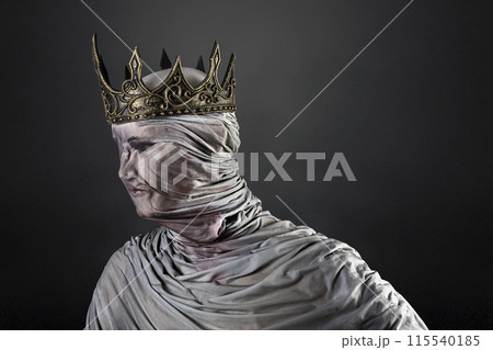 Ghost of a queen or king over dark misty background 115540185