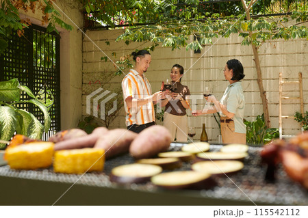 People Having Wine and BBQ People Having Wine and BBQ 115542112