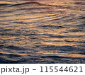 Sunset light reflects on Ocean Water 115544621