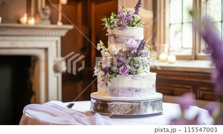 Wedding cake with lavender flowers. Festive table decoration. 115547003