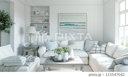 Interior of a living room with white walls, sofa and cushions. Sitting room in coastal cottage with sea view. Luxury lounge room 115547082