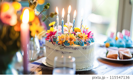 Birthday cake with candles and flowers on the table. Selective focus. 115547136