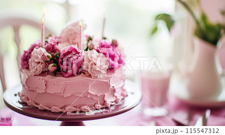 Birthday cake with candles and flowers on the table. Selective focus. 115547312