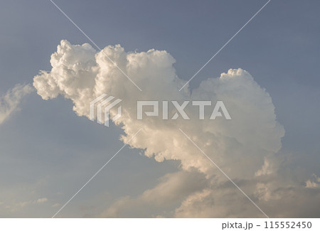 The sky is being covered with fluffy white clouds. Amazing clouds like a heaven for background wallpaper and texture. 115552450