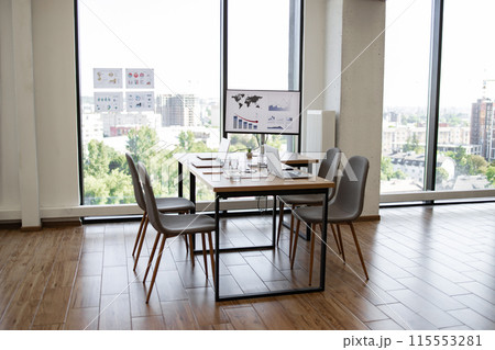 Modern conference room with panoramic city view and presentation board 115553281