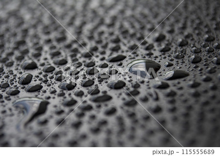 Close up of raindrops on dark background suitable for wallpaper Close up of raindrops on dark background suitable for wallpaper 115555689