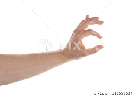 Male hand hold transparent pill isolated on white 115556534