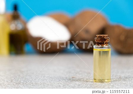 Coconut oil in a small glass bottle for skin and hair care. 115557211