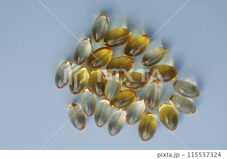 Nutrition And Vitamin Filling In Colorful Soft Gelatin Capsule. Nutrition And Vitamin Filling In Colorful Soft Gelatin Capsule. 115557324