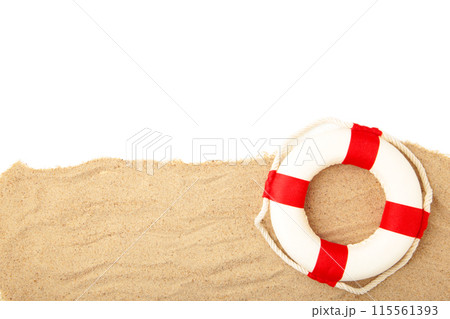Red-white lifebuoy with sand isolated on white background 115561393