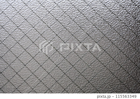 ワイヤーガラスから差し込む光 115563349