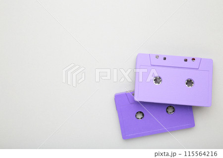 Two old colorful cassettes on a grey background. Music day 115564216