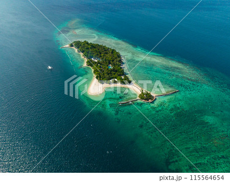 Top view of Island with sandy coastline, boat floating over the blue sea. Samal, Davao. Philippines. Seascape. Top view of Island with sandy coastline, boat floating over the blue sea. Samal, Davao. Philippines. Seascape. 115564654