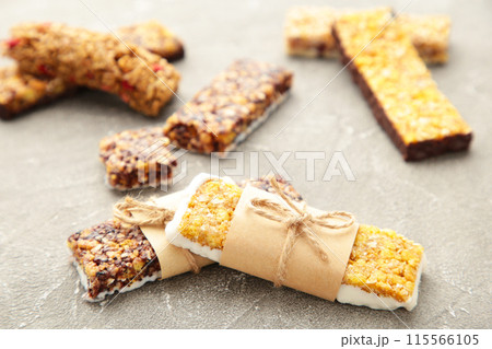 Granola bars on grey background. Diet and breakfast Granola bars on grey background. Diet and breakfast 115566105