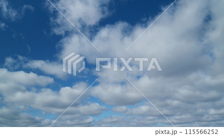 Tropical summer sunlight. White and blue stratocumulus clouds background. Tropical summer morning bright sunlight. Timelapse. Tropical summer sunlight. White and blue stratocumulus clouds background. Tropical summer morning bright sunlight. Timelapse. 115566252