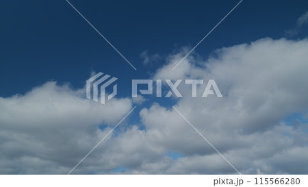 Changing stratocumulus cloudscape. Clouds in blue sky slowly move and change shape. Timelapse. Changing stratocumulus cloudscape. Clouds in blue sky slowly move and change shape. Timelapse. 115566280