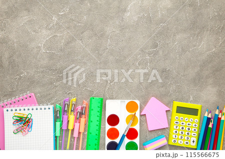 Back to school concept on grey concrete background. Top view Back to school concept on grey concrete background. Top view 115566675